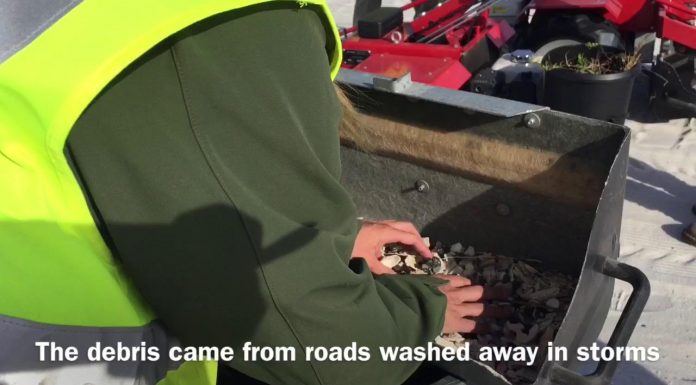 watch:-asphalt-is-removed-from-the-sand-along-fort-pickens-road